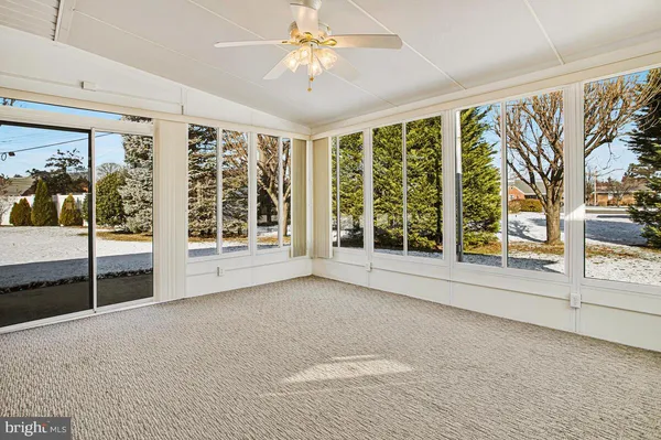 a view of an empty room with windows