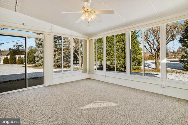 a view of an empty room with windows