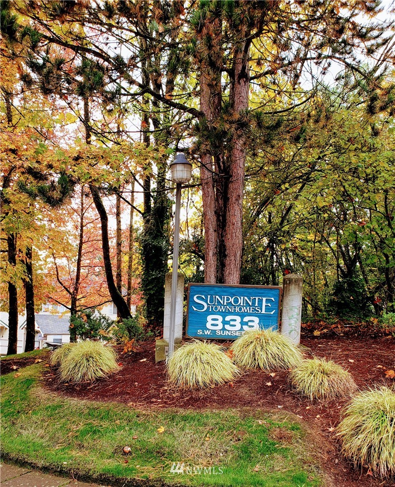 833 Southwest Sunset Boulevard, Unit B7 Renton, WA 98057 - Photo 1 of 33 a view of street sign under a large tree