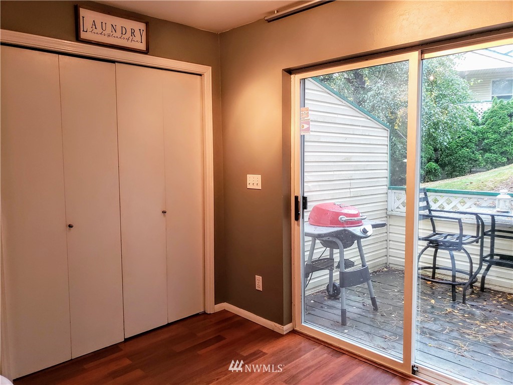 833 Southwest Sunset Boulevard, Unit B7 Renton, WA 98057 - Photo 8 of 33 a view of a room that has a window and wooden floor