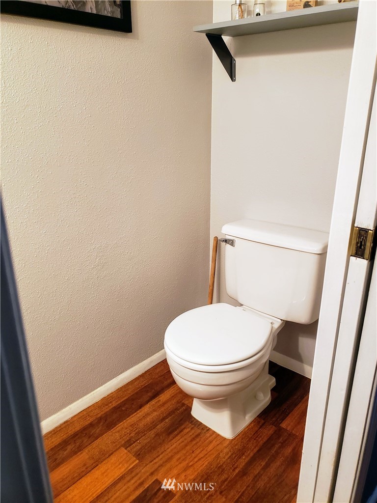 833 Southwest Sunset Boulevard, Unit B7 Renton, WA 98057 - Photo 9 of 33 a bathroom with a sink and a toilet