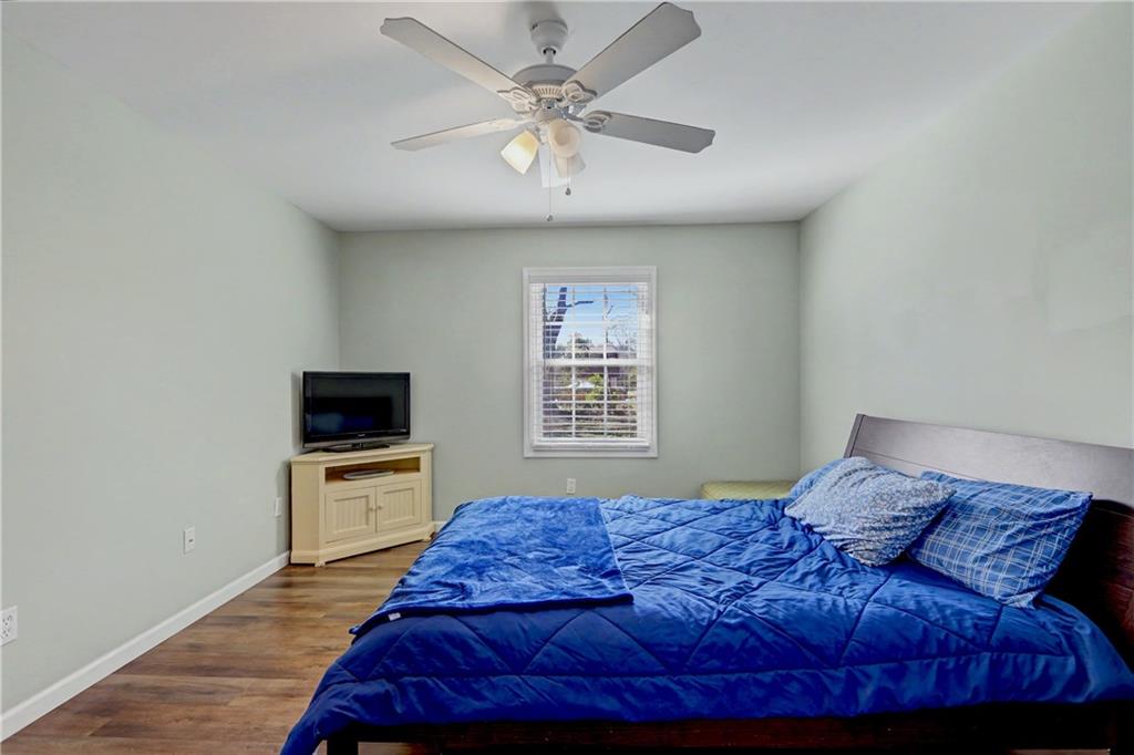 134 Church Road Thomaston, GA 30286 - Photo 13 of 33 a bedroom with a bed and a tv