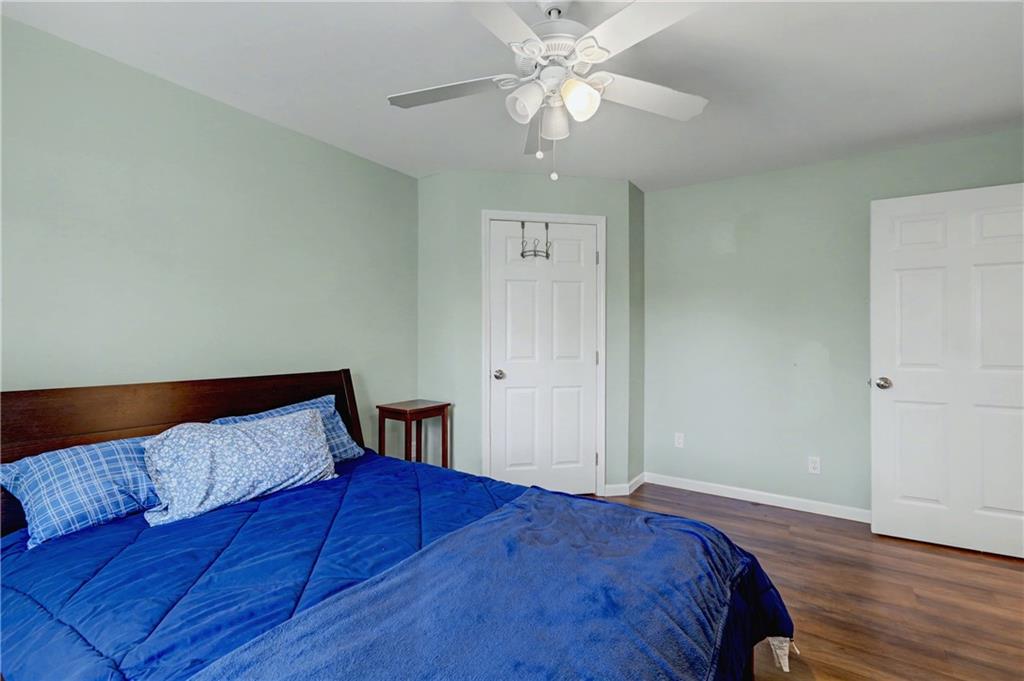 134 Church Road Thomaston, GA 30286 - Photo 14 of 33 a bedroom with a bed and wooden floor