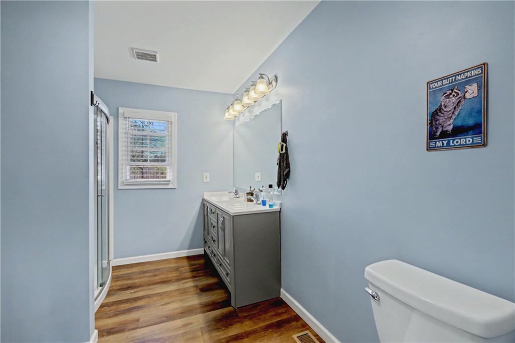 134 Church Road Thomaston, GA 30286 - Photo 15 of 33 a bathroom with a granite countertop toilet and a sink