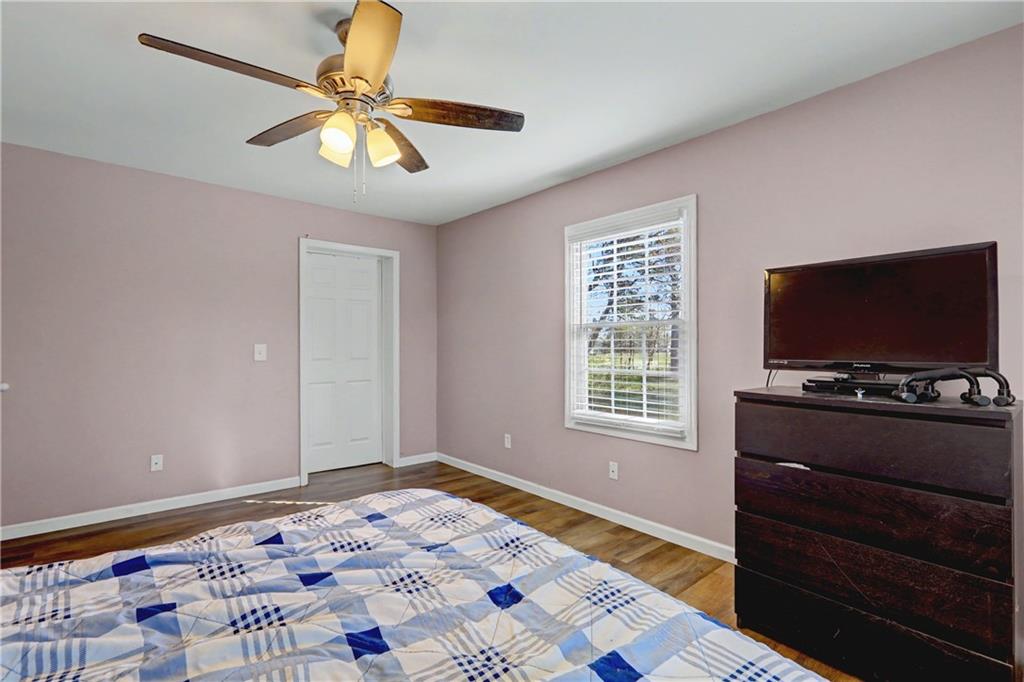 134 Church Road Thomaston, GA 30286 - Photo 20 of 33 a bedroom with a bed and a flat screen tv