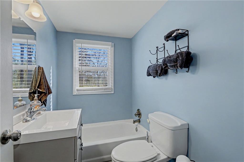 134 Church Road Thomaston, GA 30286 - Photo 21 of 33 a bathroom with a toilet sink and mirror