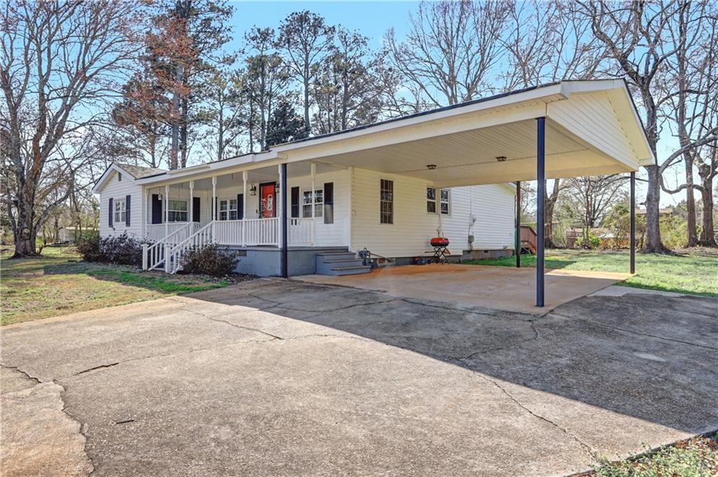 134 Church Road Thomaston, GA 30286 - Photo 28 of 33 a view of a house with backyard and trees