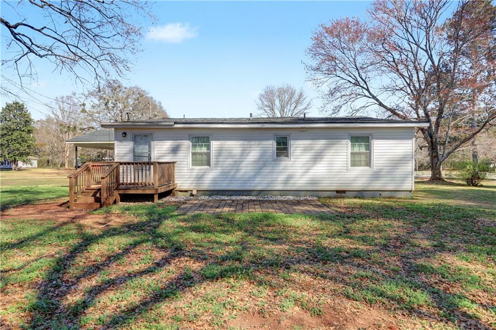 134 Church Road Thomaston, GA 30286 - Photo 32 of 33 a view of back yard of the house with outdoor seating