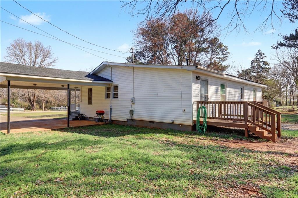 134 Church Road Thomaston, GA 30286 - Photo 33 of 33 a view of a house with a yard and a tree