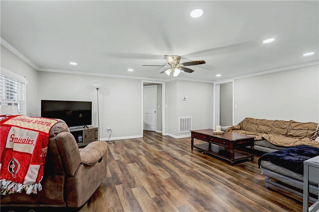 134 Church Road Thomaston, GA 30286 - Photo 6 of 33 a bedroom with furniture and a flat screen tv