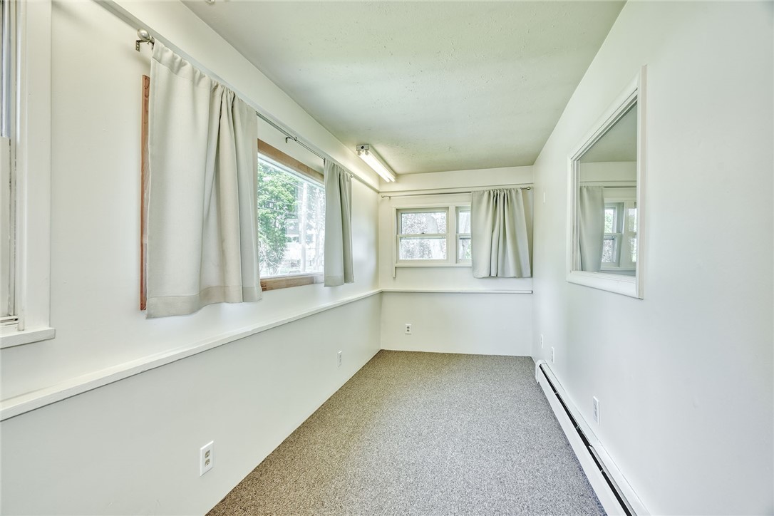 27 Martin Street Webster, NY 14580 - Photo 7 of 48 ENLCOSED FRONT PORCH - 4- SEASONS - HEATED