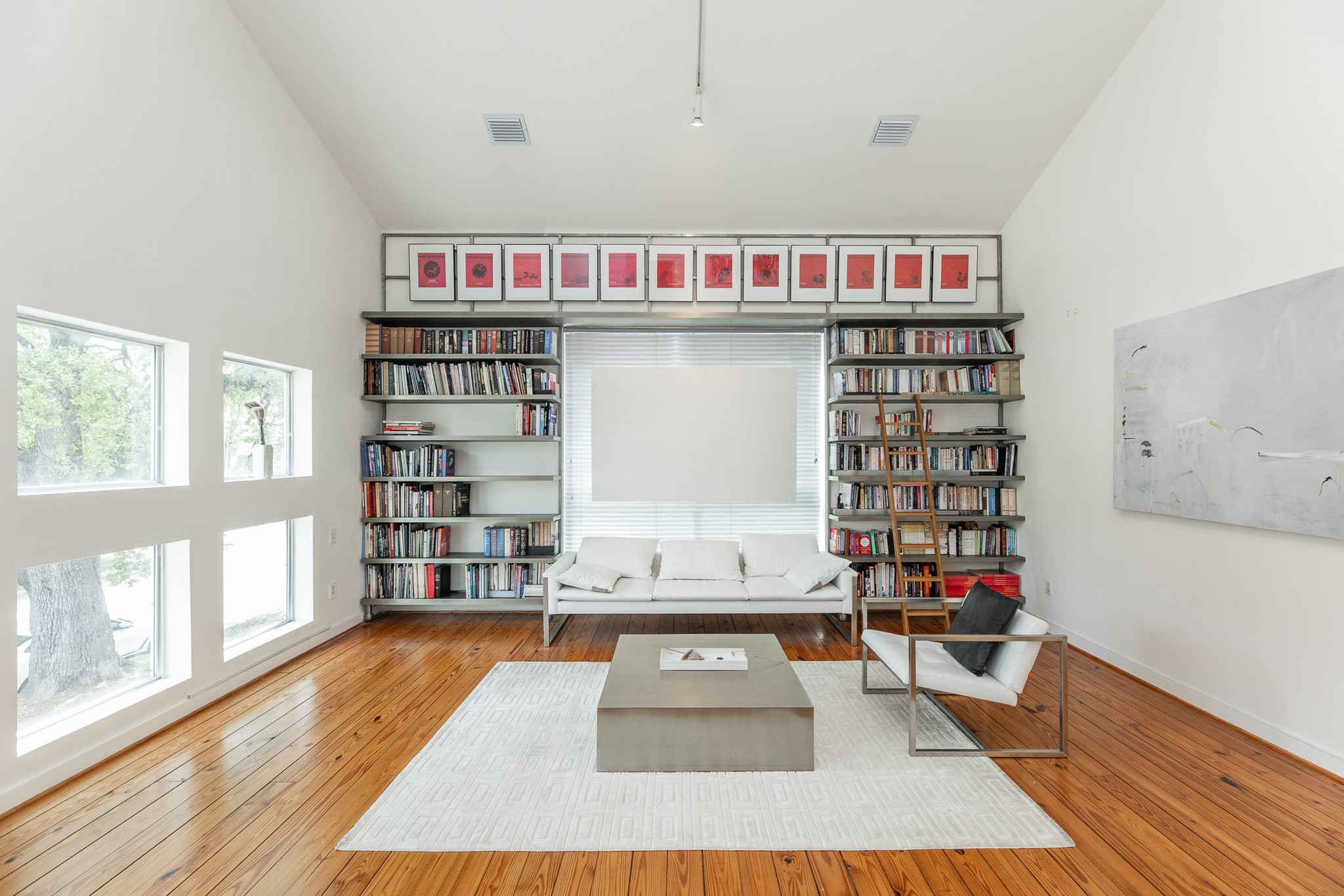2714 Chenevert Street Houston, TX 77004 - Photo 11 of 40 a living room with furniture and a book shelf