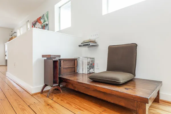 a living room with furniture and a table