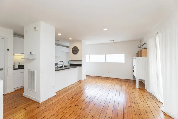 a view of a kitchen from the hallway