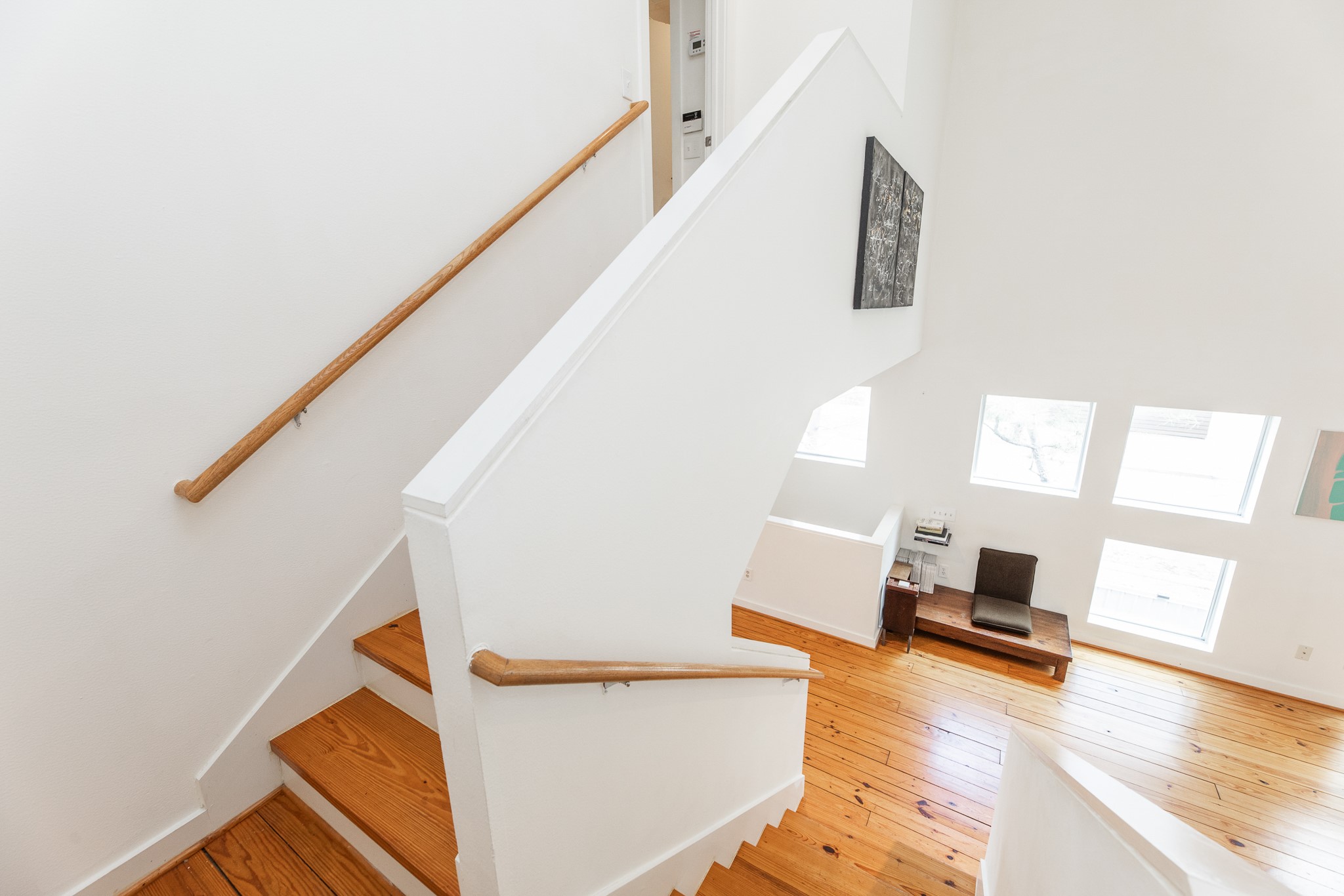 2714 Chenevert Street Houston, TX 77004 - Photo 24 of 40 a living room with wooden floor and a large window