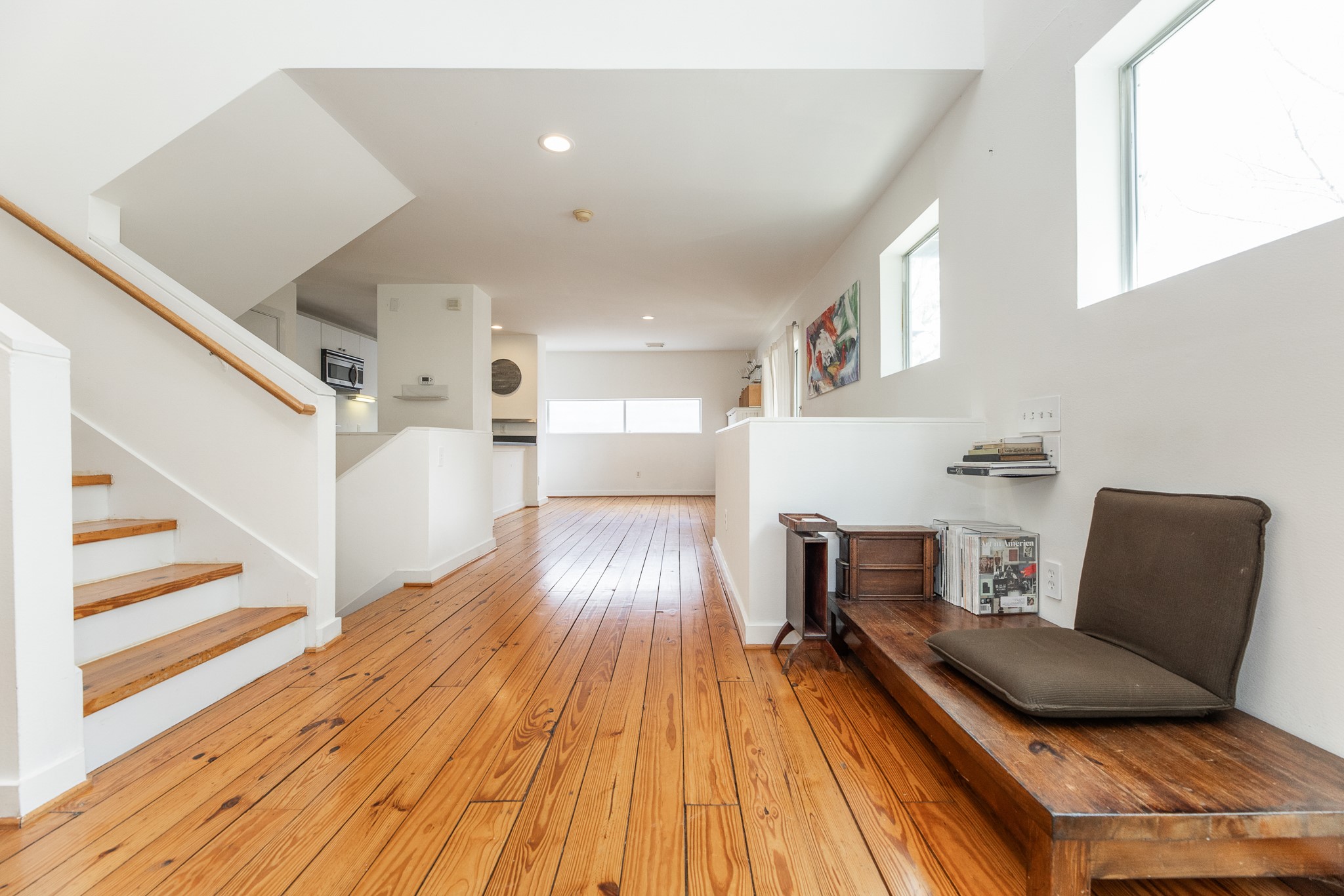 2714 Chenevert Street Houston, TX 77004 - Photo 25 of 40 a living room with furniture and a wooden floor