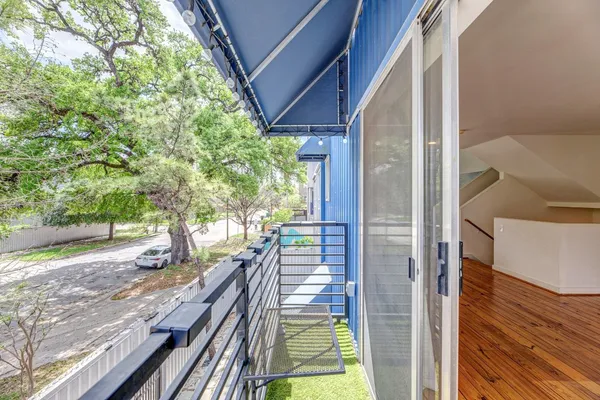 a view of balcony and yard