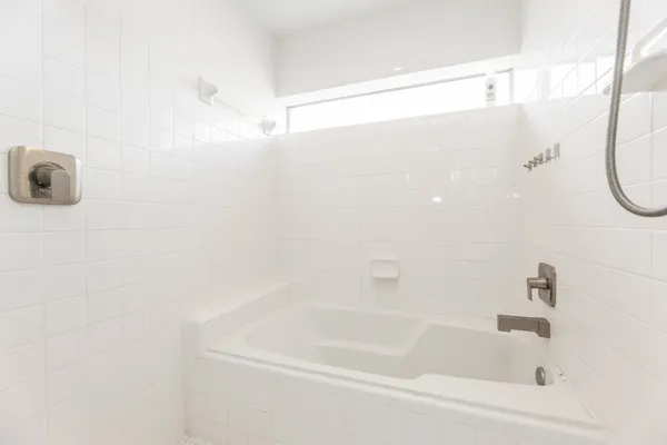 a close up of a bathtub in a bathroom