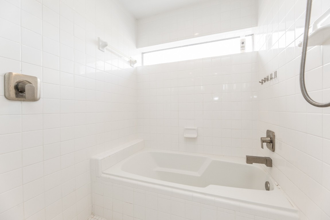 2714 Chenevert Street Houston, TX 77004 - Photo 34 of 40 a close up of a bathtub in a bathroom