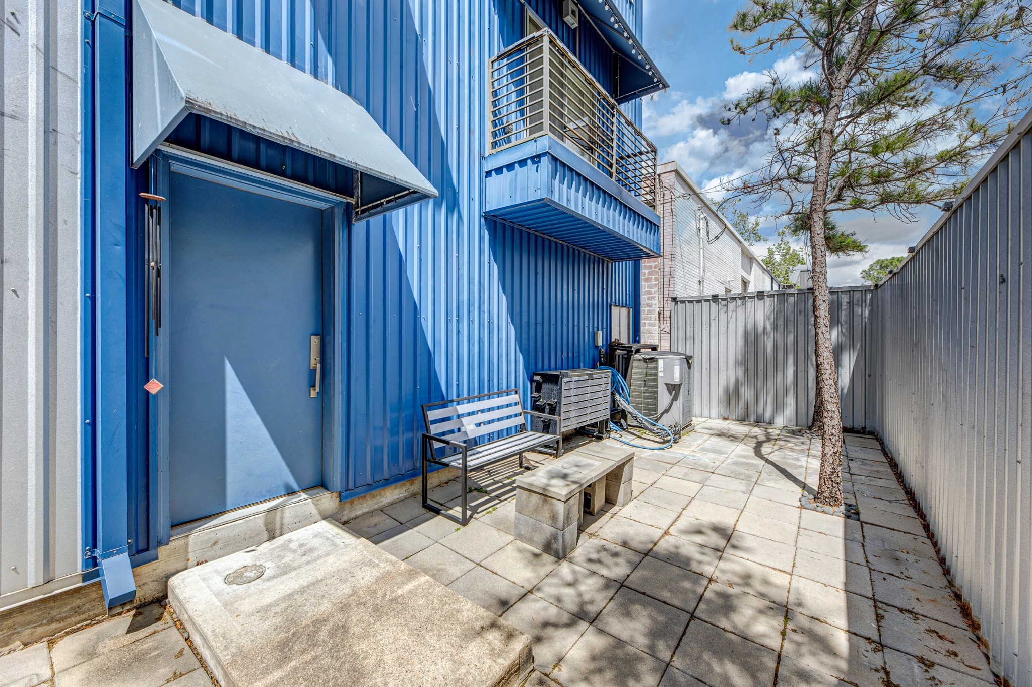 2714 Chenevert Street Houston, TX 77004 - Photo 4 of 40 a view of a wooden door and chair in the balcony