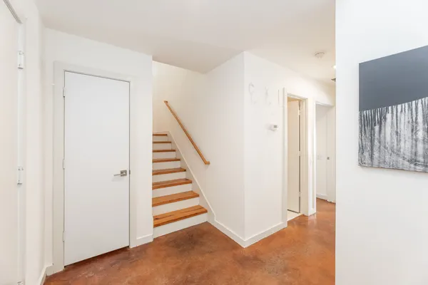 a view of a hallway with staircase