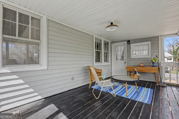 a balcony view with a seating space