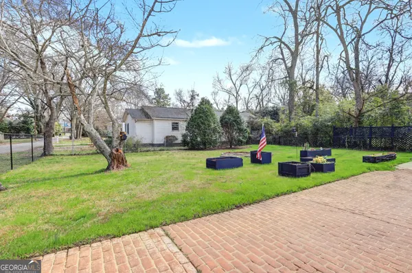 a view of a house with backyard and a slide