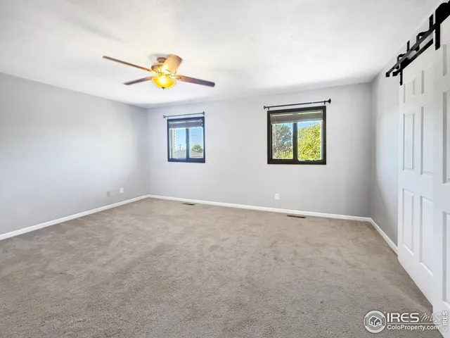 a view of a bedroom with a window