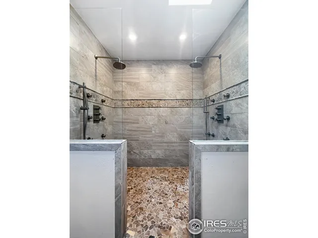 a bathroom with a shower and a sink