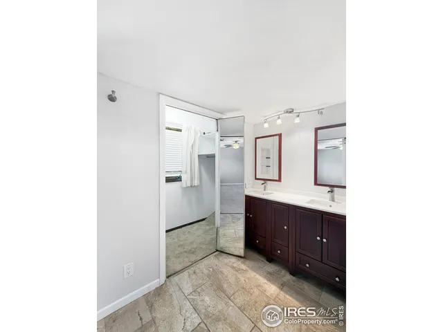 a spacious bathroom with a tub shower and sink