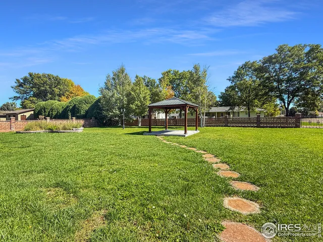 a view of a house with a big yard