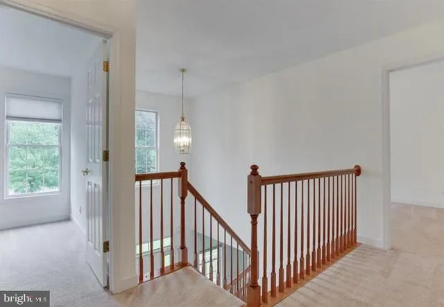 a view of a hallway with windows