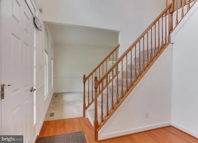 a view of an entryway with wooden floor