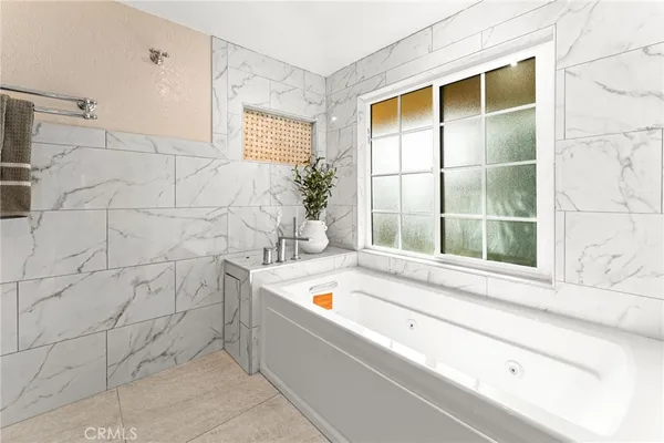 a bathroom with a tub and shower