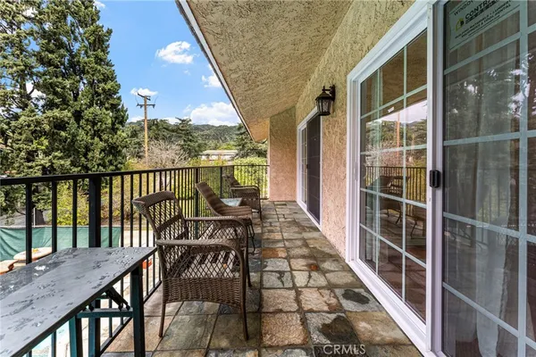 a view of balcony with furniture
