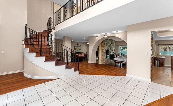 a view of living room kitchen and entryway