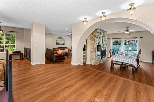 a view of livingroom with furniture hardwood floor and windows