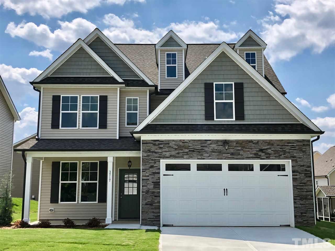 3717 Massey Ridge Court Raleigh, NC 27616 - Photo 1 of 24 a front view of a house with a yard