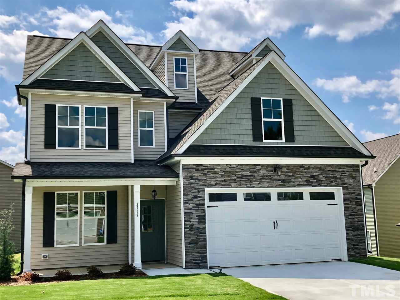 3717 Massey Ridge Court Raleigh, NC 27616 - Photo 2 of 24 a front view of a house with a yard