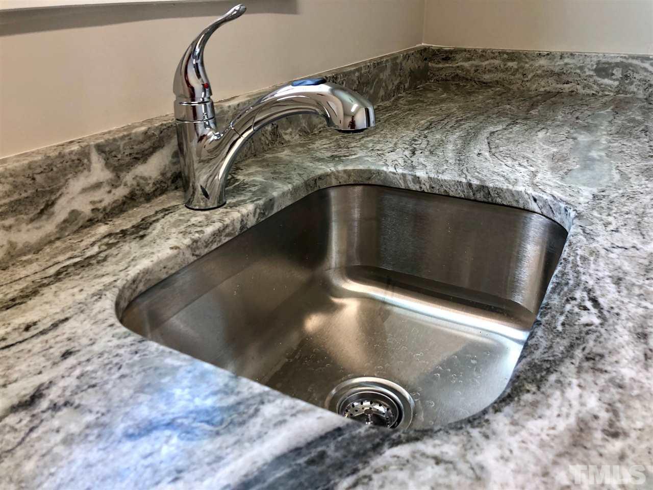 3717 Massey Ridge Court Raleigh, NC 27616 - Photo 22 of 24 a close view of sink tap