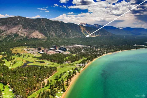 a view of a town with mountains in the background