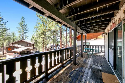 a balcony with wooden floor