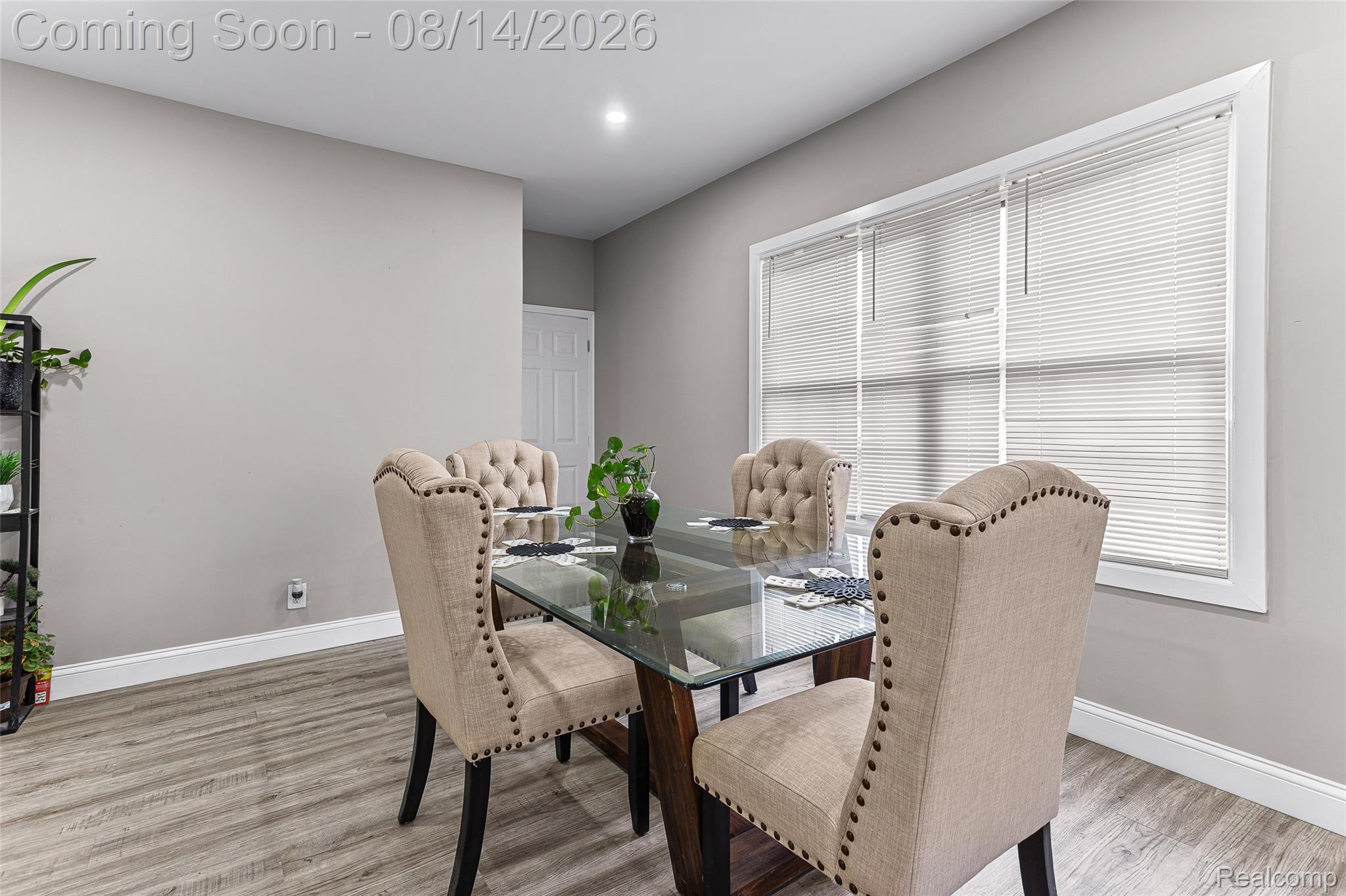 4472 French Road Detroit, MI 48214 - Photo 7 of 23 Recessed ceiling lighting illuminates the interior space, featuring wood-finish flooring and a white trimmed window