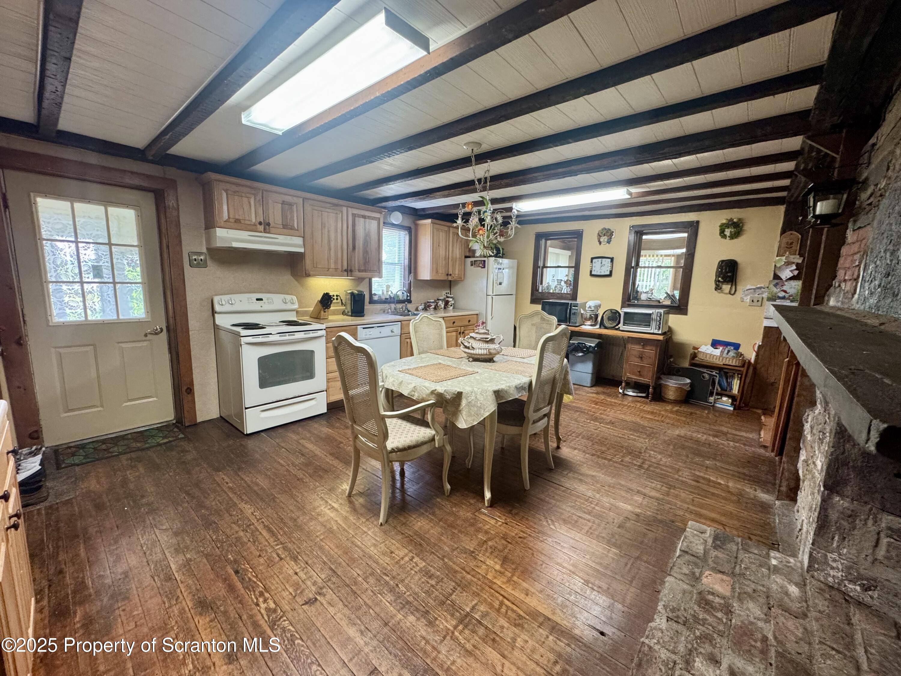 1325 Fairview Road Clarks Summit, PA 18411 - Photo 13 of 21 a view of a dining room with furniture window and wooden floor