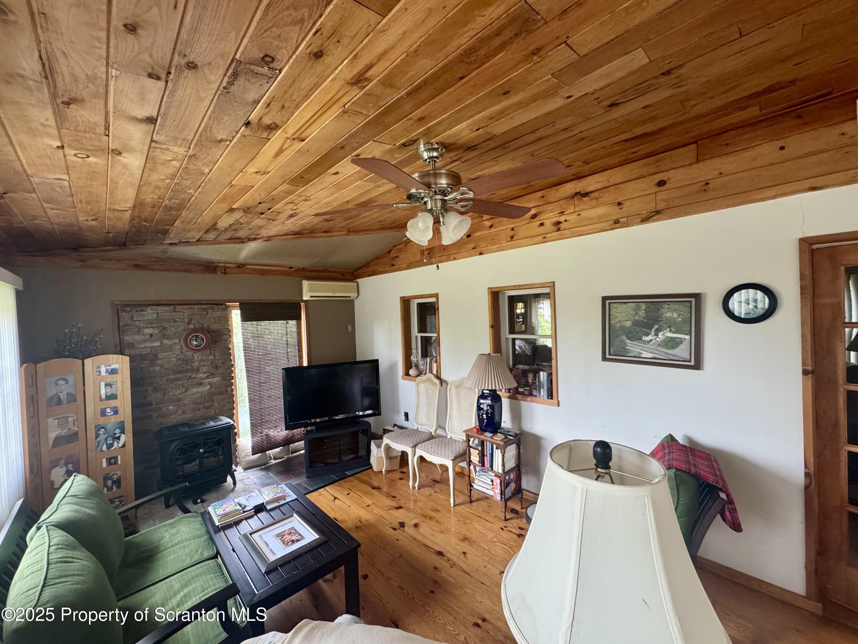 1325 Fairview Road Clarks Summit, PA 18411 - Photo 14 of 21 a living room with furniture and a flat screen tv