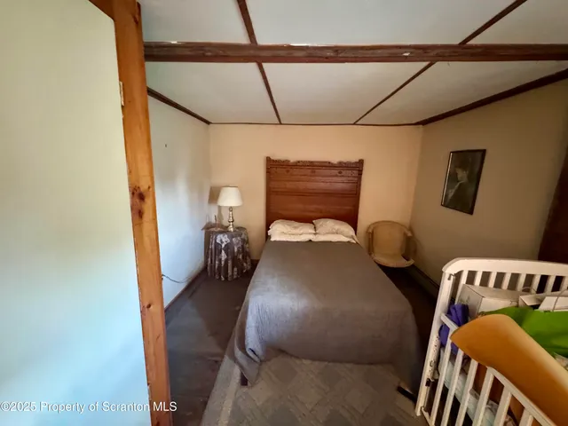 a view of bathroom with a toilet sink and mirror