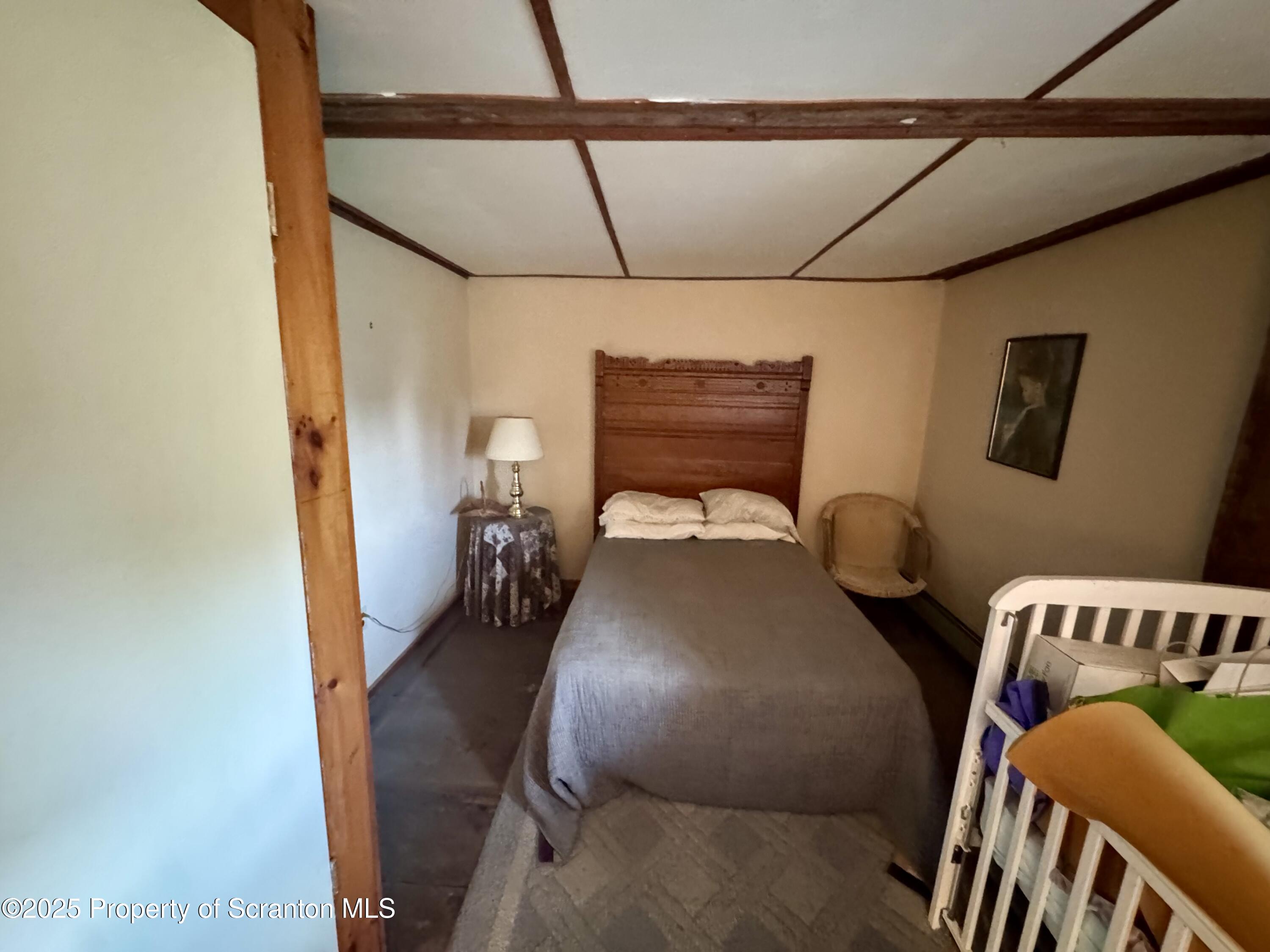 1325 Fairview Road Clarks Summit, PA 18411 - Photo 16 of 21 a bed room with furniture and a window