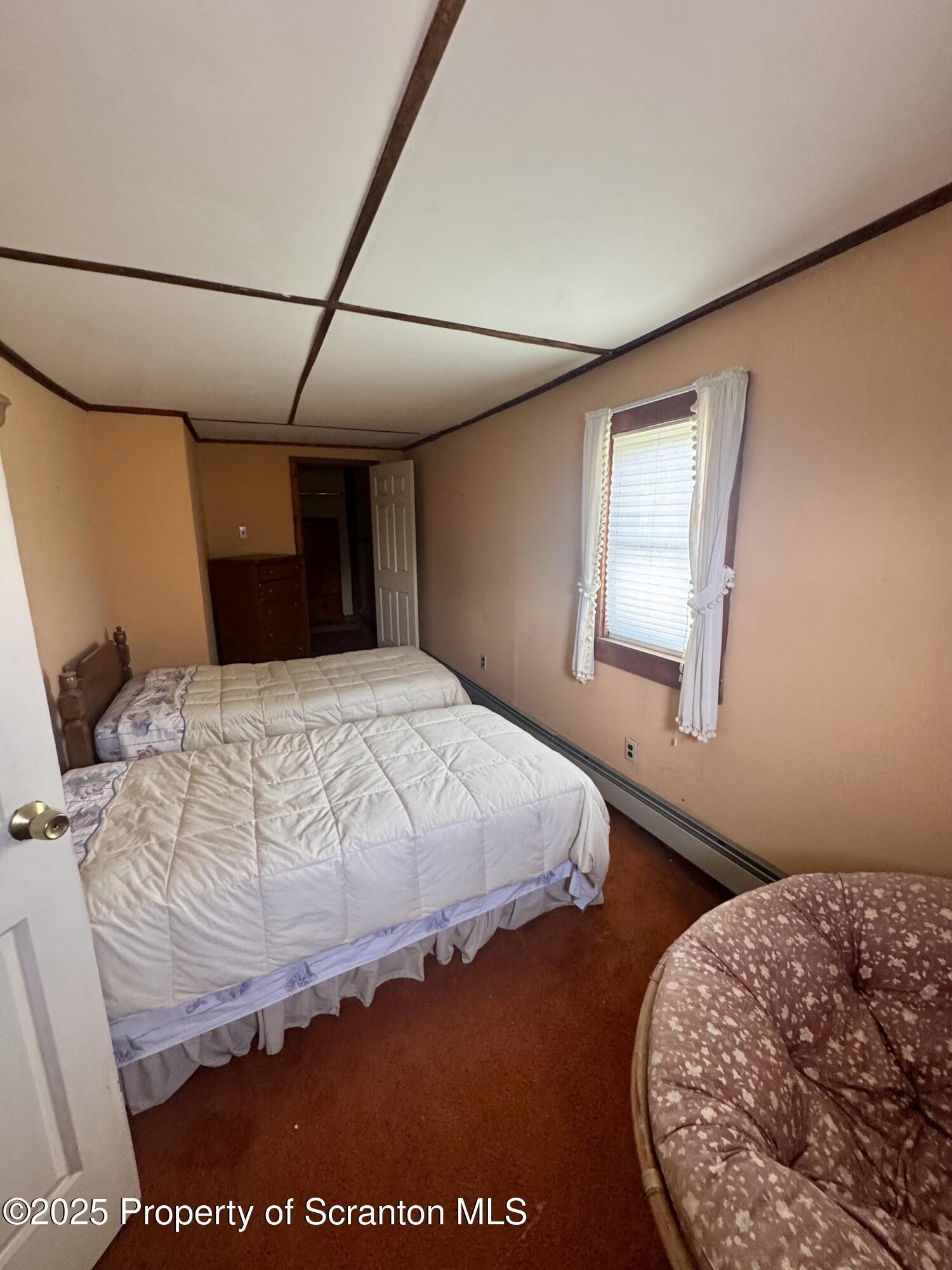 1325 Fairview Road Clarks Summit, PA 18411 - Photo 20 of 21 a bedroom with a bed and wooden floor
