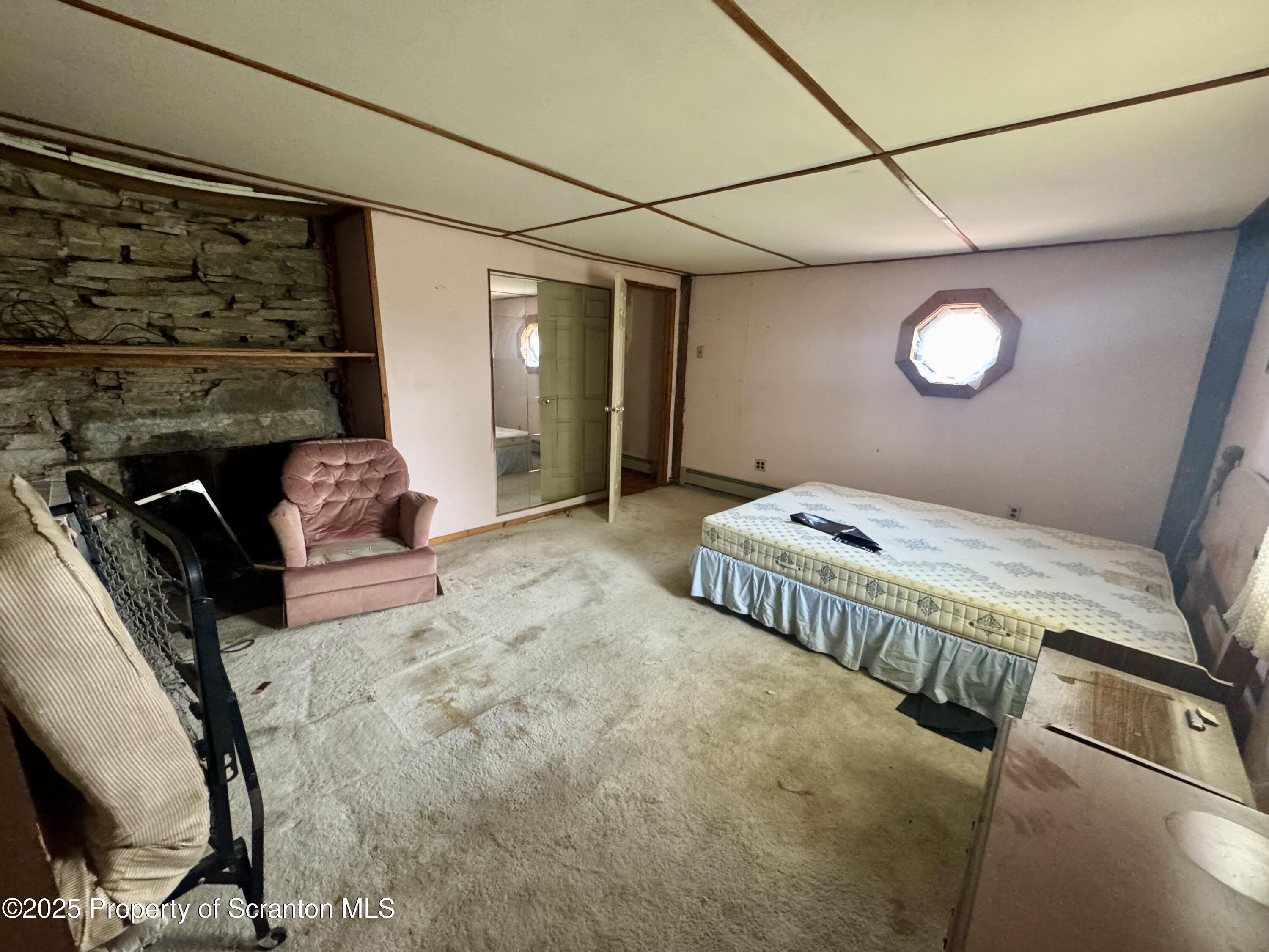 1325 Fairview Road Clarks Summit, PA 18411 - Photo 21 of 21 a bedroom with furniture and a window