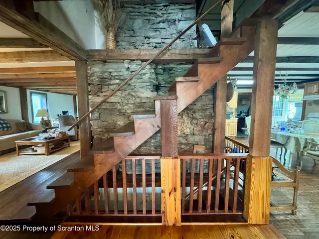 a view of balcony with wooden floor